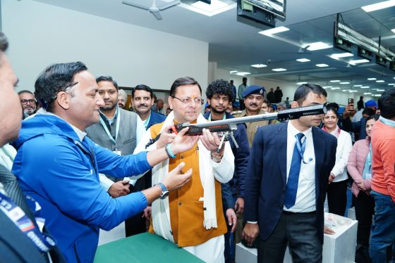 CM Pushkar Singh Dhami checking gun at Shooting range at Raipur stadium Dehradun