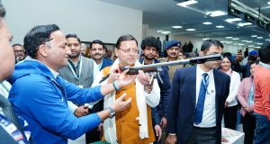 CM Pushkar Singh Dhami checking gun at Shooting range at Raipur stadium Dehradun