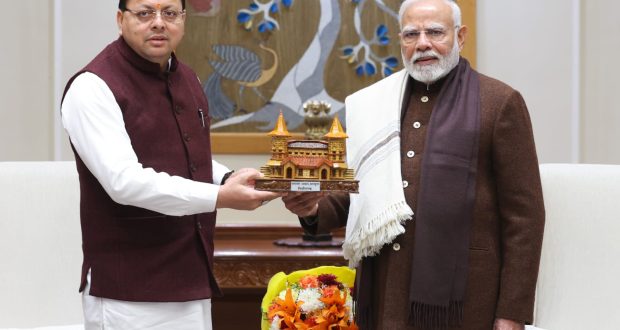 CM Dhami giving replica of Sri Kedarnath Dham to PM Modi