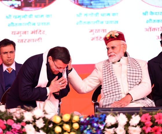 PM Modi patting CM Dhami in Uttarkashi