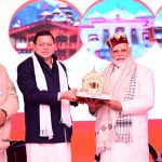 CM Dhami is giving replica of Gangotri to PM Modi