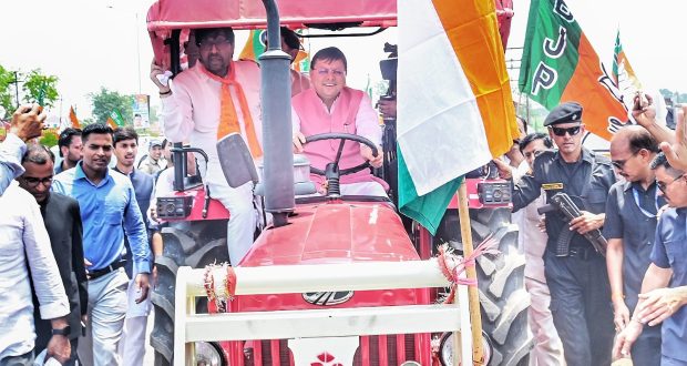 CM Pushkar Singh Dhami driving tractor