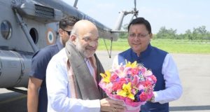 Union Home Minister Amit Shah being welcomed by CM Pushkar Singh Dhami