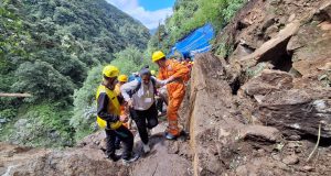 Pilgrims being guided by security personnel on Kedarnath pedestrian route