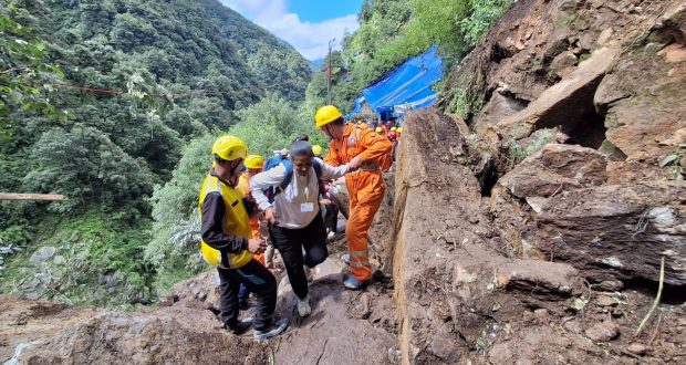 Pilgrims being guided by security personnel on Kedarnath pedestrian route