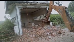 Illegal tomb being demolished in Ramnagar, Nainital
